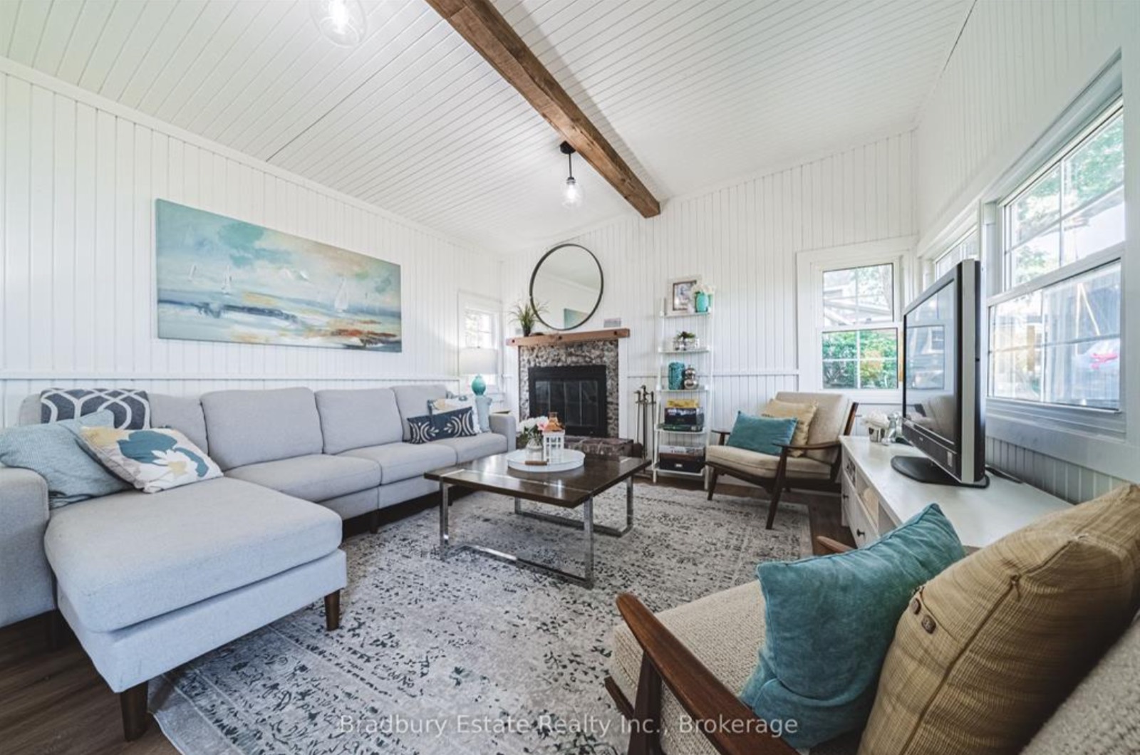 Living room after, a light sectional and a large rug