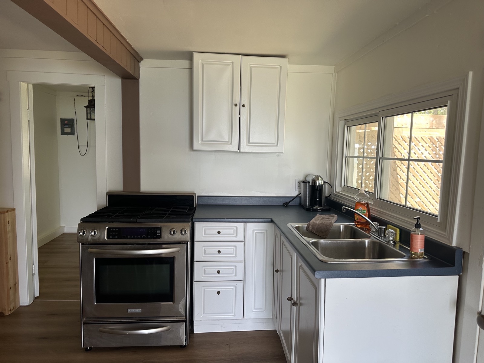 Kitchen before, dated cabinets
