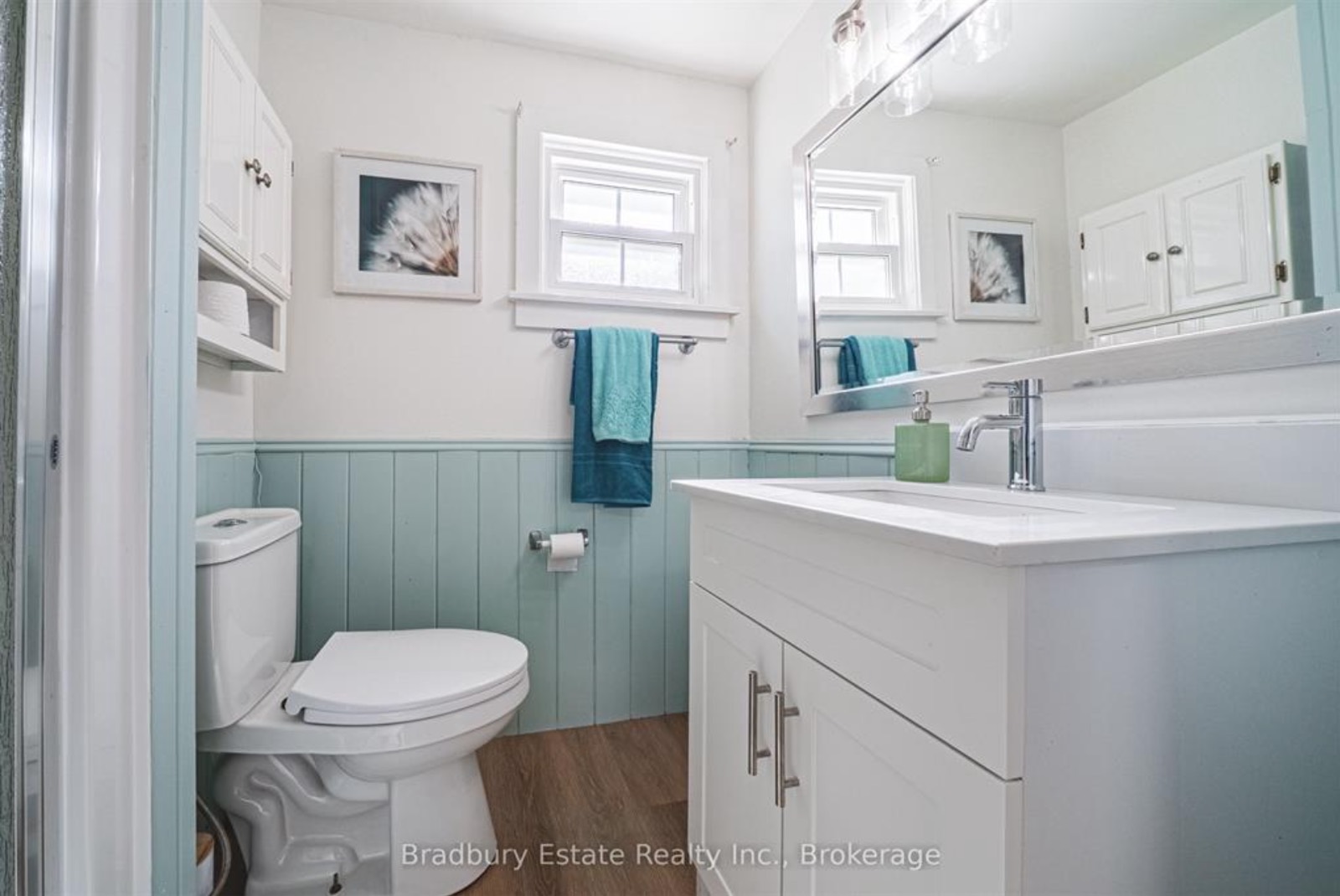 Bathroom after, painted panelling, new mirror and art