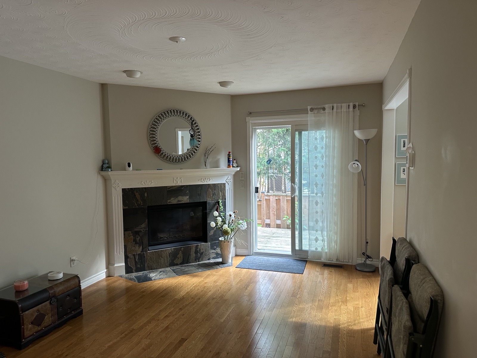 Empty living room before, with a fireplace