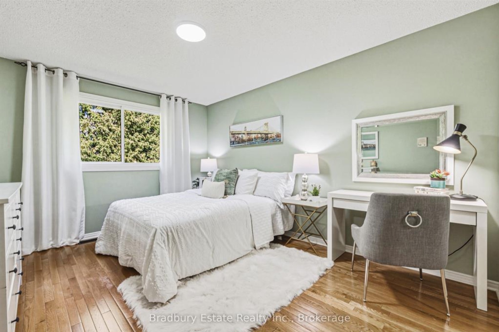 Green bedroom after, white bedding and a desk