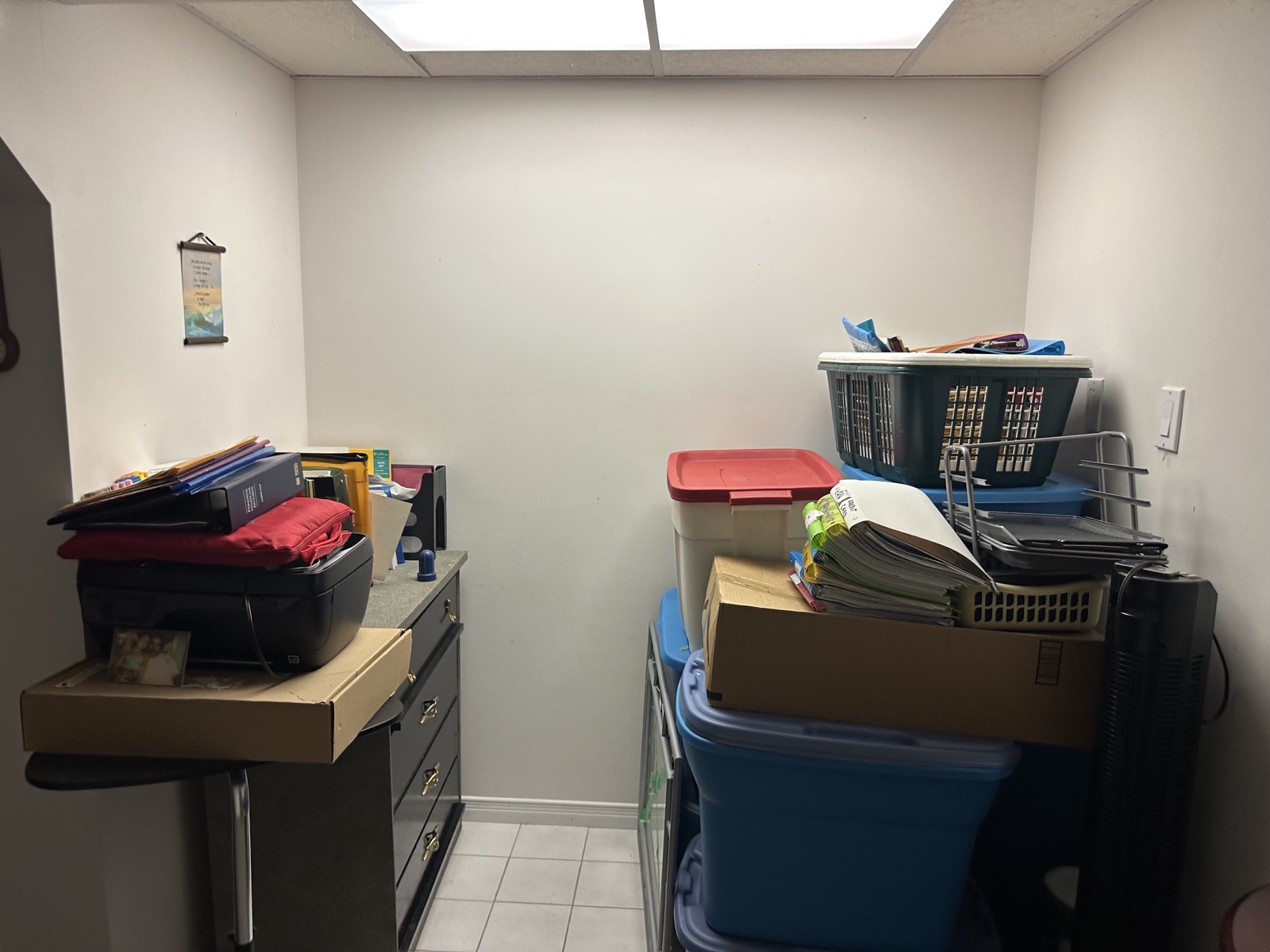 Basement nook before, boxes and bins