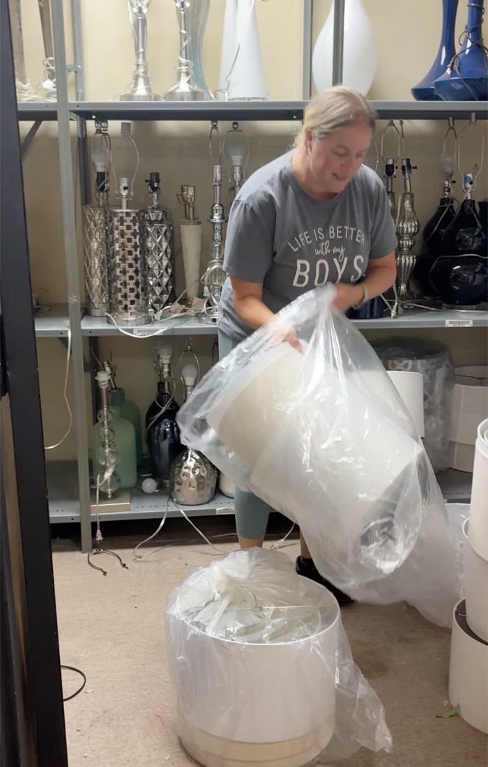 Wrapping a lamp in the staging store-room